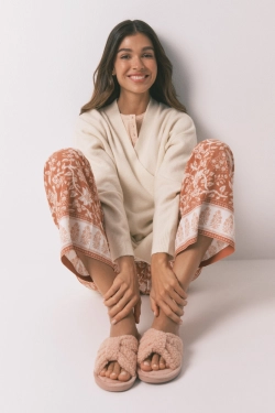 Рожеві домашні капці з ефектом овчини