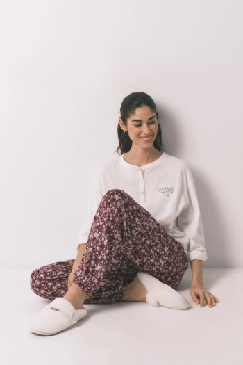 Довгі бордові штани з квітковим принтом